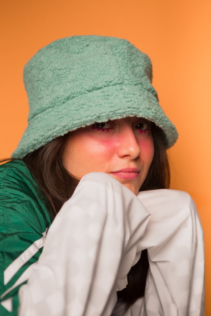 Woman with Bright Makeup and Cap